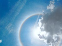 Rainbow ring around sun. Free public domain CC0 photo.
