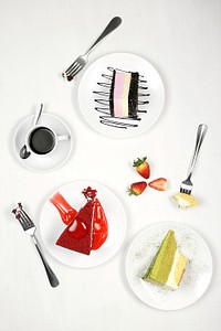 Free cake slices, forks, strawberries and coffee cup on white dish isolated on white background photo, public domain food CC0 image.