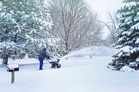 Free man shoveling snow with machine photo, public domain winter CC0 image.