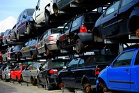 Broken cars waiting to be taken apart. Free public domain CC0 photo.