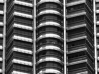 Abstract skyscraper symmetry in black and white. Free public domain CC0 photo.