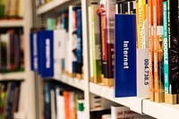 Bookshelf in library. Free public domain CC0 photo