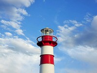 Closeup on red and white lighthouse. Free public domain CC0 photo.