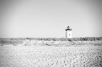 Lighthouse on open field. Free public domain CC0 photo.
