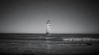 Lighthouse in middle of ocean. Free public domain CC0 image. 