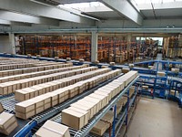 Boxes for delivery on conveyor belt. Free public domain CC0 photo.