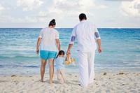 Family on beach vacation. Free public domain CC0 photo.