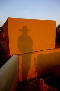 Silhouette of cowboy, background photo. Free public domain CC0 image.