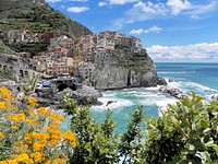 A view Cinque Terre from the coast, Manarola, Italy. Free public domain CC0 photo.