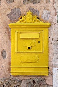 Yellow mailbox. Free public domain CC0 photo.
