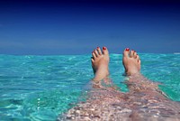 Woman floating in sea. Free public domain CC0 photo.