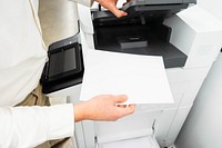 Free close up of person hands using photocopier machine in office image, public domain CC0 photo.
