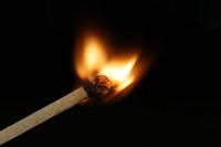 Flame on matching stick. Free public domain CC0 photo.