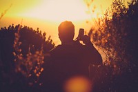 Photographer at sunset. Free public domain CC0 photo.