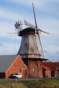 Rustic windmill building in the countryside. Free public domain CC0 image.