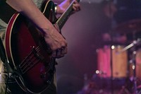 Musician playing guitar, music background.Free public domain CC0 photo.