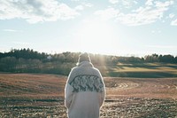 Man standing in field. Free public domain CC0 photo.