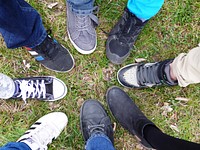 Friends standing together in circle. Free public domain CC0 photo.