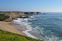 Calm waves crashing into beach. Free public domain CC0 image.