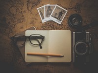 Desk with vintage camera. Free public domain CC0 image.