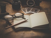 Desk with vintage camera. Free public domain CC0 image.