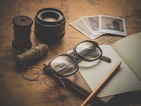 Desk with vintage camera. Free public domain CC0 image.