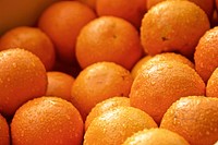 Closeup on pile of fresh oranges. Free public domain CC0 photo.