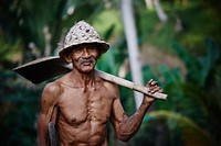 Old man working in the jungle - unknown date & location