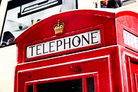 Iconic red phone booth in London, England. Free public domain CC0 photo.