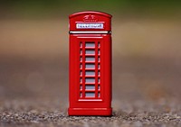 Iconic red phone booth in London, England. Free public domain CC0 photo.