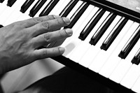 Pianist practicing on piano. Free public domain CC0 photo.