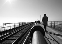 Man walking on bridge. Free public domain CC0 photo.