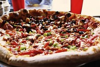 Closeup on pizza with toppings. Free public domain CC0 photo.