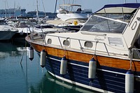 Yacht docking by the marina. Free public domain CC0 photo.