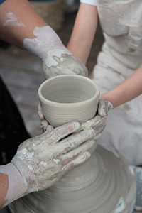 Working with clay in potetry studio. Free public domain CC0 photo.
