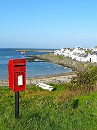 Red mail box in neighborhood. Free public domain CC0 image.