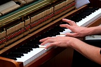 Pianist practicing on piano. Free public domain CC0 photo.