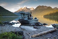 Boat on shore with scenery. Free public domain CC0 photo.