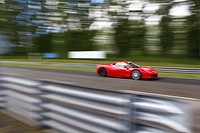 Sports car racing on the track. Free public domain CC0 photo.