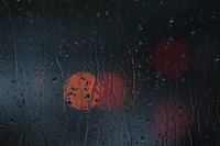 Rain on glass with bokeh. Free public domain CC0 photo.