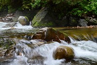 Water flowing down rocks. Free public domain CC0 image.