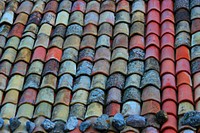 Stones on tile roof. Free public domain CC0 image.