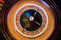 Roulette wheel at casino. Free public domain CC0 photo.