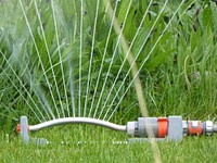 Sprinklers in the garden. Free public domain CC0 photo.