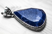 Shiny blue stone pendant jewelry. Free public domain CC0 photo.