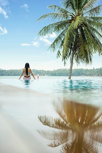 Free woman sitting on swimming pool photo, public domain travel CC0 image.