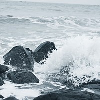 Sea waves washing over rocks. Free public domain CC0 photo.