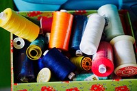 Colorful thread stored in a box. Free public domain CC0 photo.