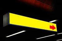 Yellow sign with red arrow. Free public domain CC0 image.