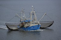 Sailing fishing boat with nets. Free public domain CC0 photo.